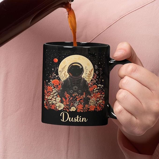 Astronaut with Moon and Wildflowers Coffee Mug, Custom Name Ceramic Cup 11oz 15oz, Unique Astronaut Coffee Cup for Friends, Personalized Astronomy Black Mug, Gifts for Birthday
